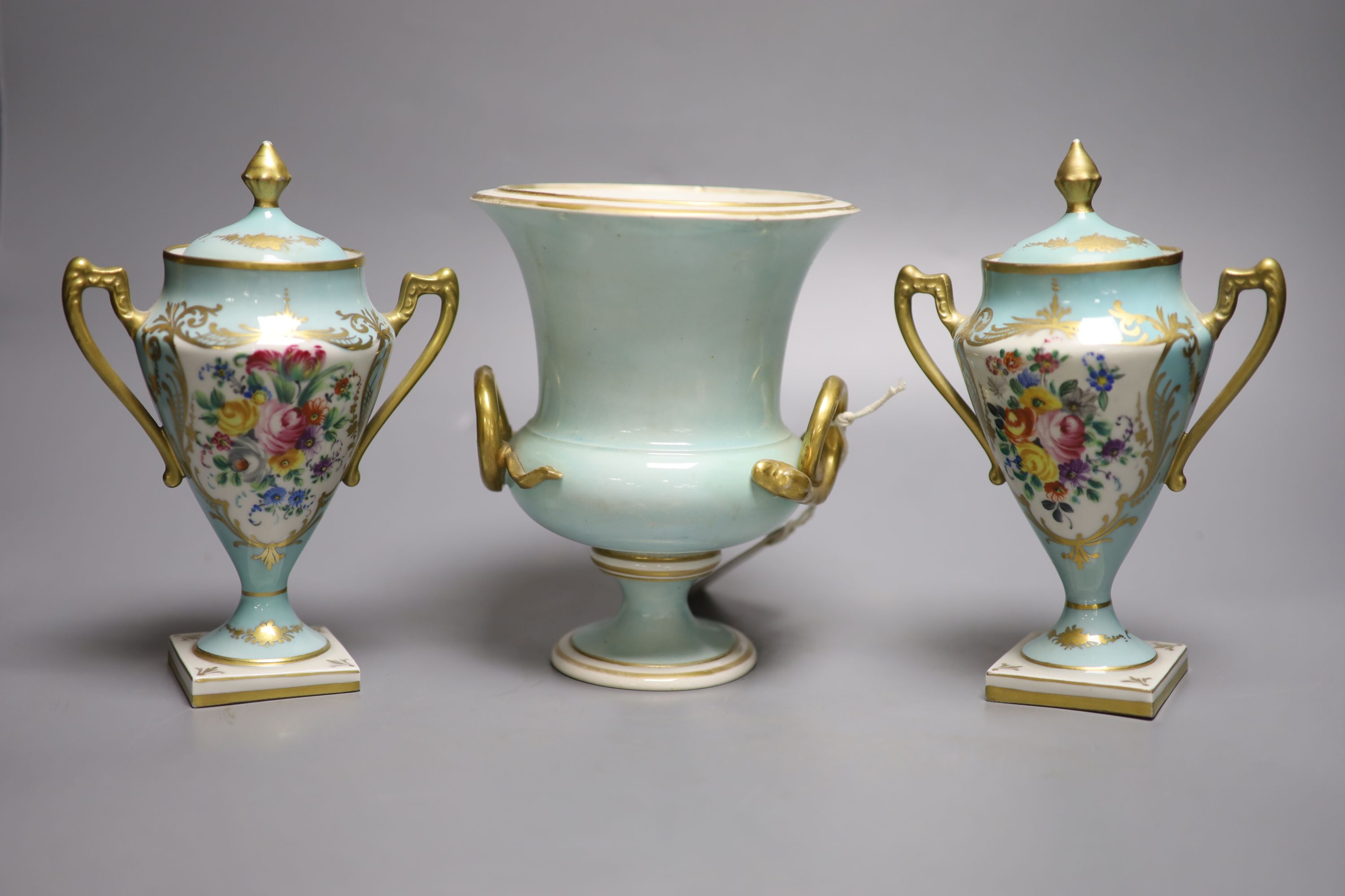 A Derby urn, In Italy, height 17cm and a pair of French porcelain urns and covers